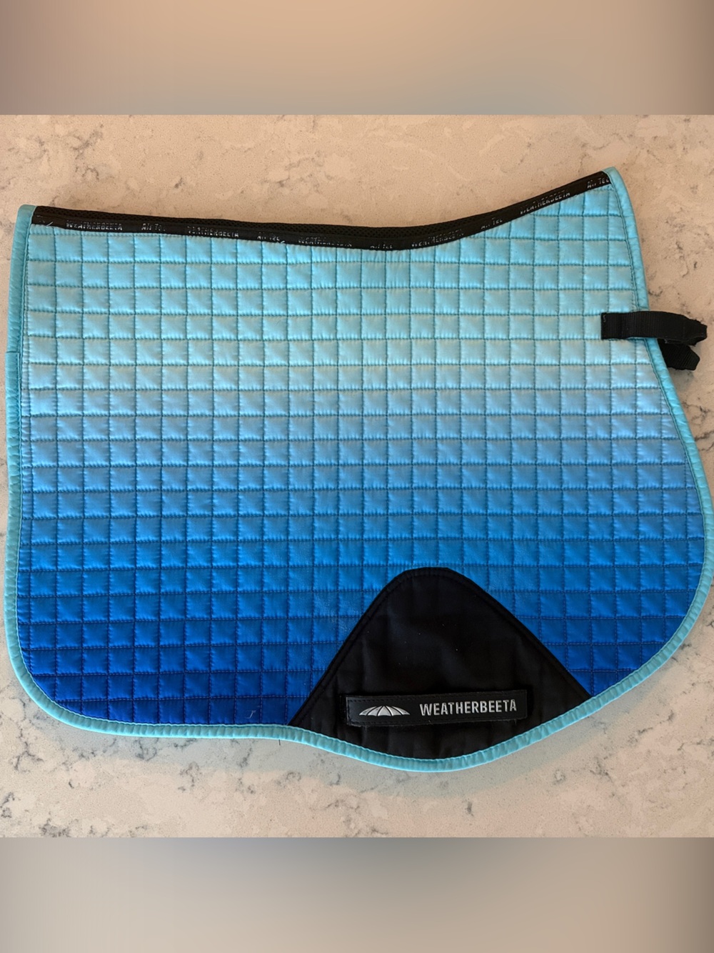Weatherbeeta saddle pad. Full size spine is 24 inches